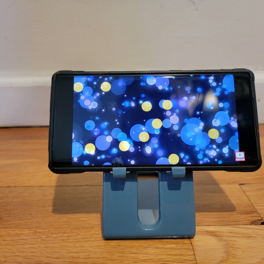 Phone holder for table or outlet